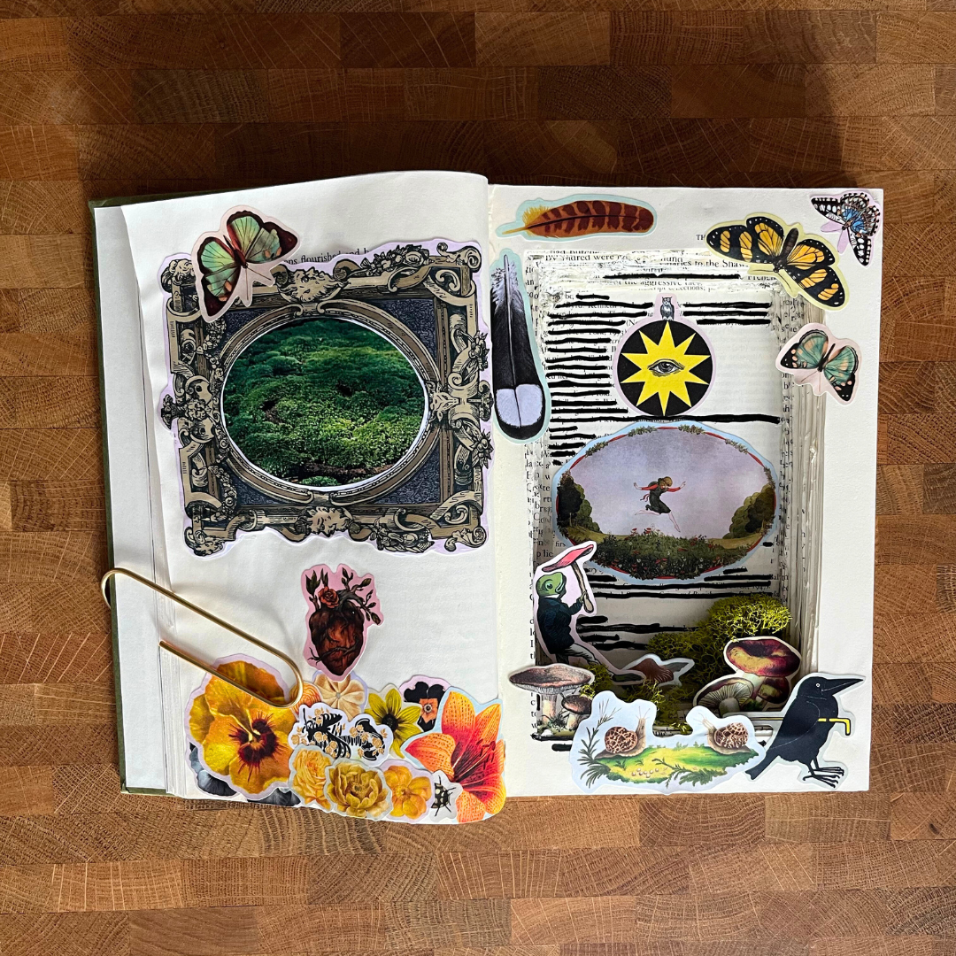 Open book with various stickers on a wooden surface