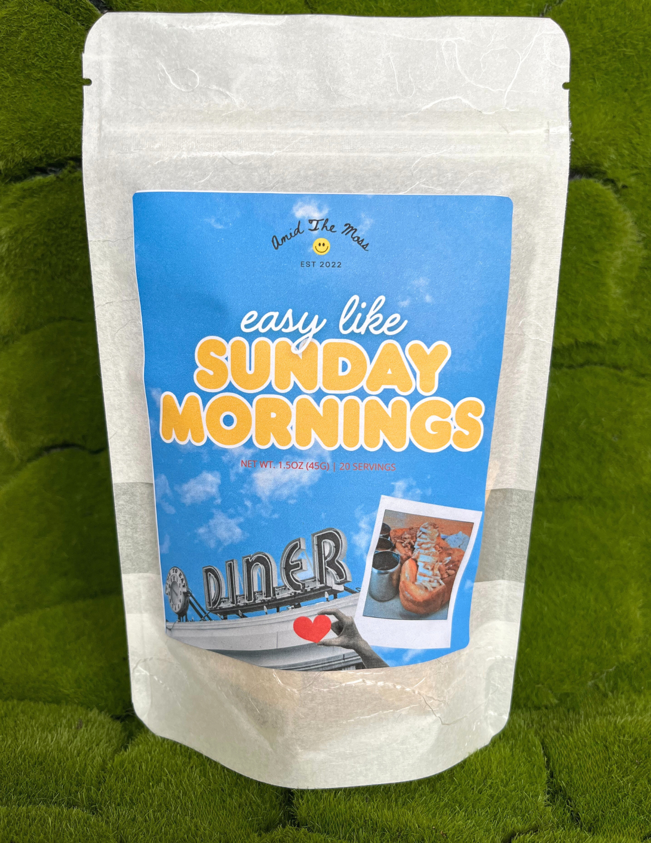 White snack bag with blue label featuring 'easy like Sunday Mornings' text on a green background