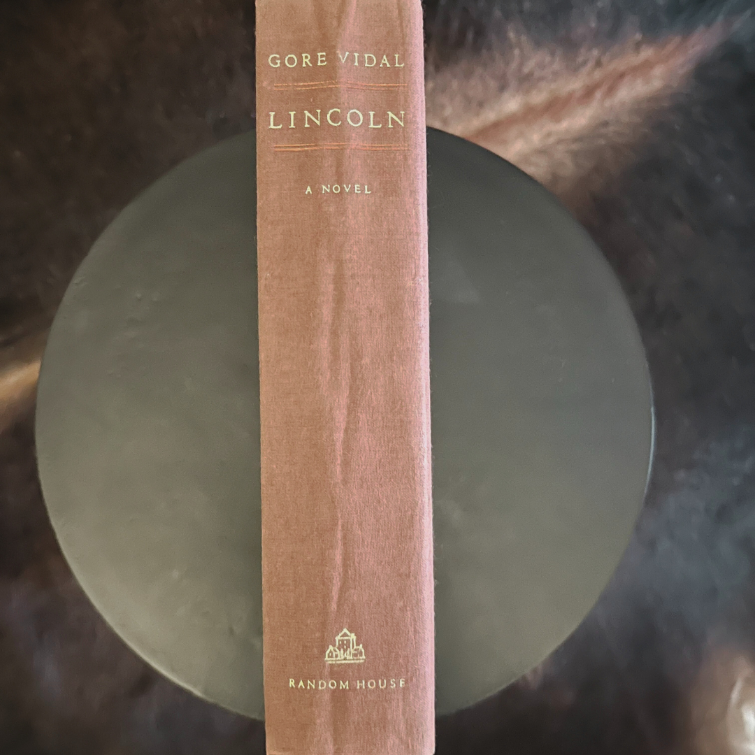 Book titled 'Lincoln' by Gore Vidal with a brown spine on a dark background