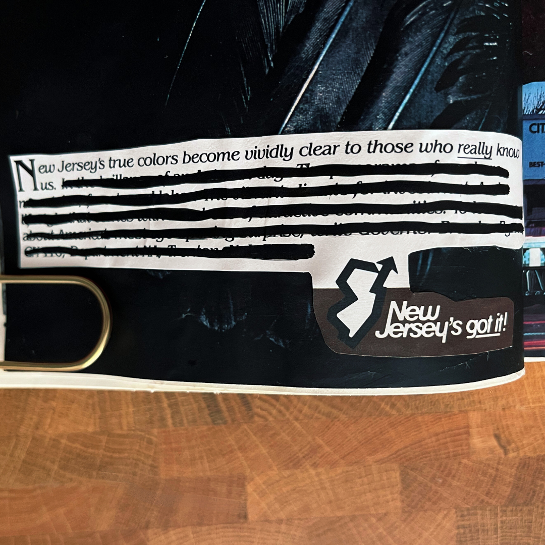 Belt with New Jersey-themed design on a wooden surface