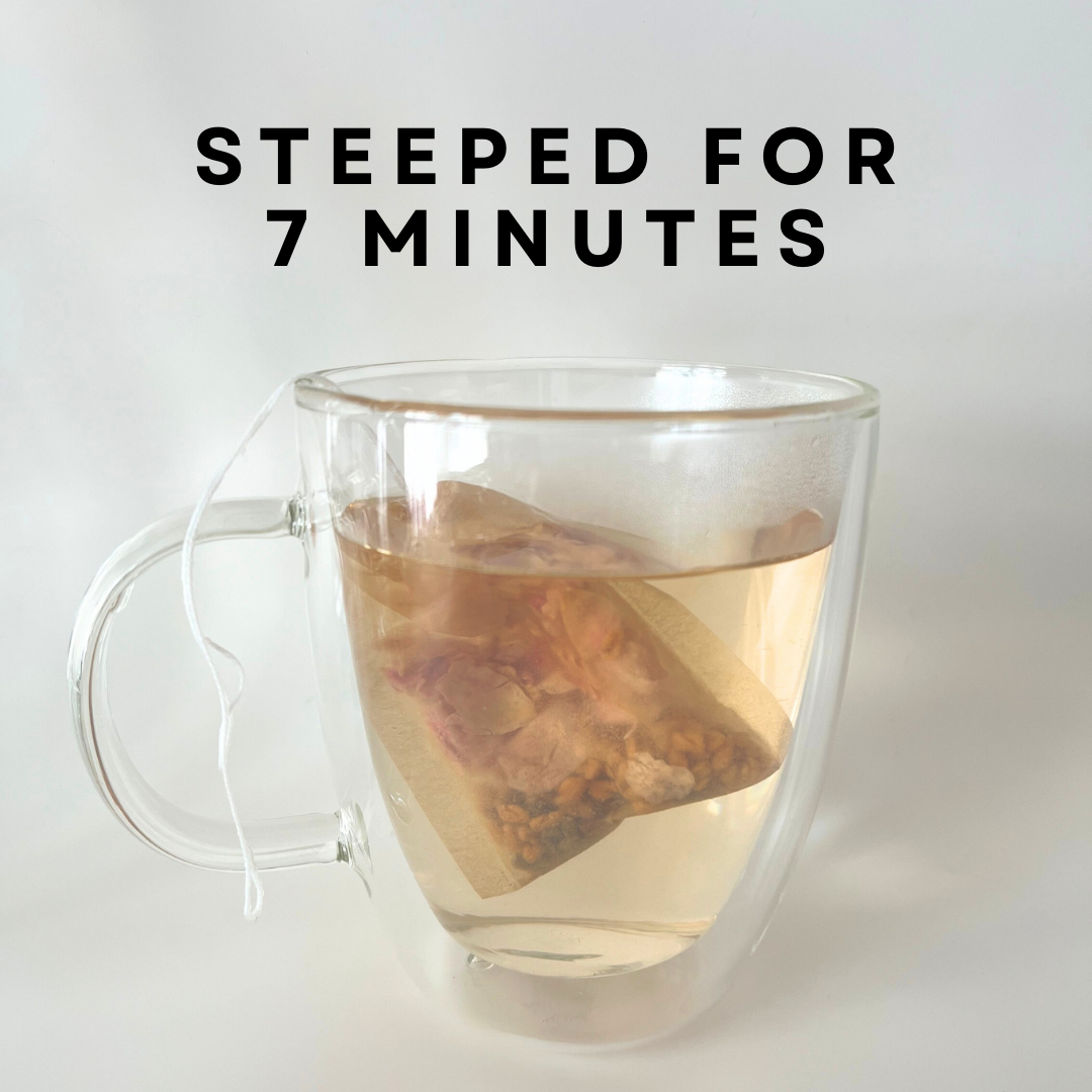 Clear glass mug with a tea bag steeping in water, text 'Steeped for 7 minutes' above.