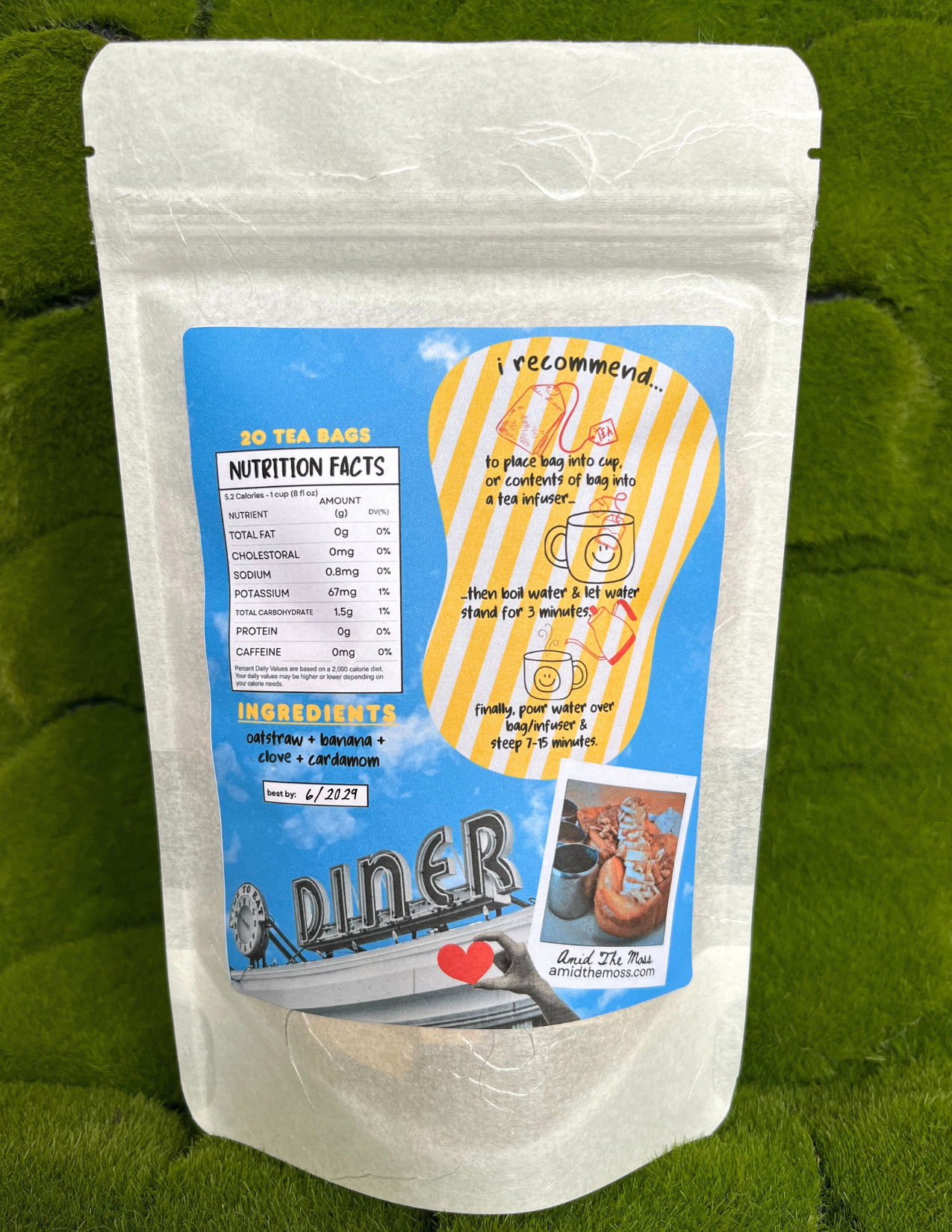 Tea bag package with a blue label on a green leaf background