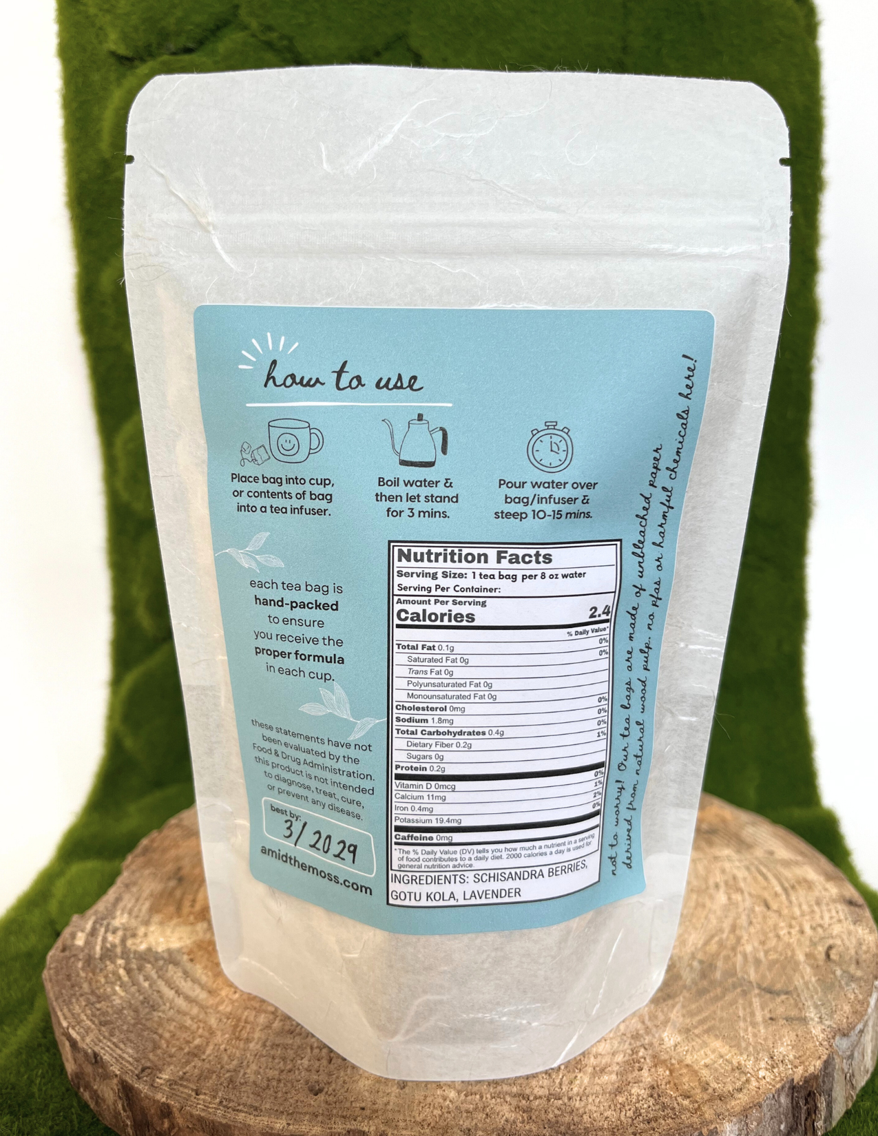 Tea package with label on a wooden block against a green background