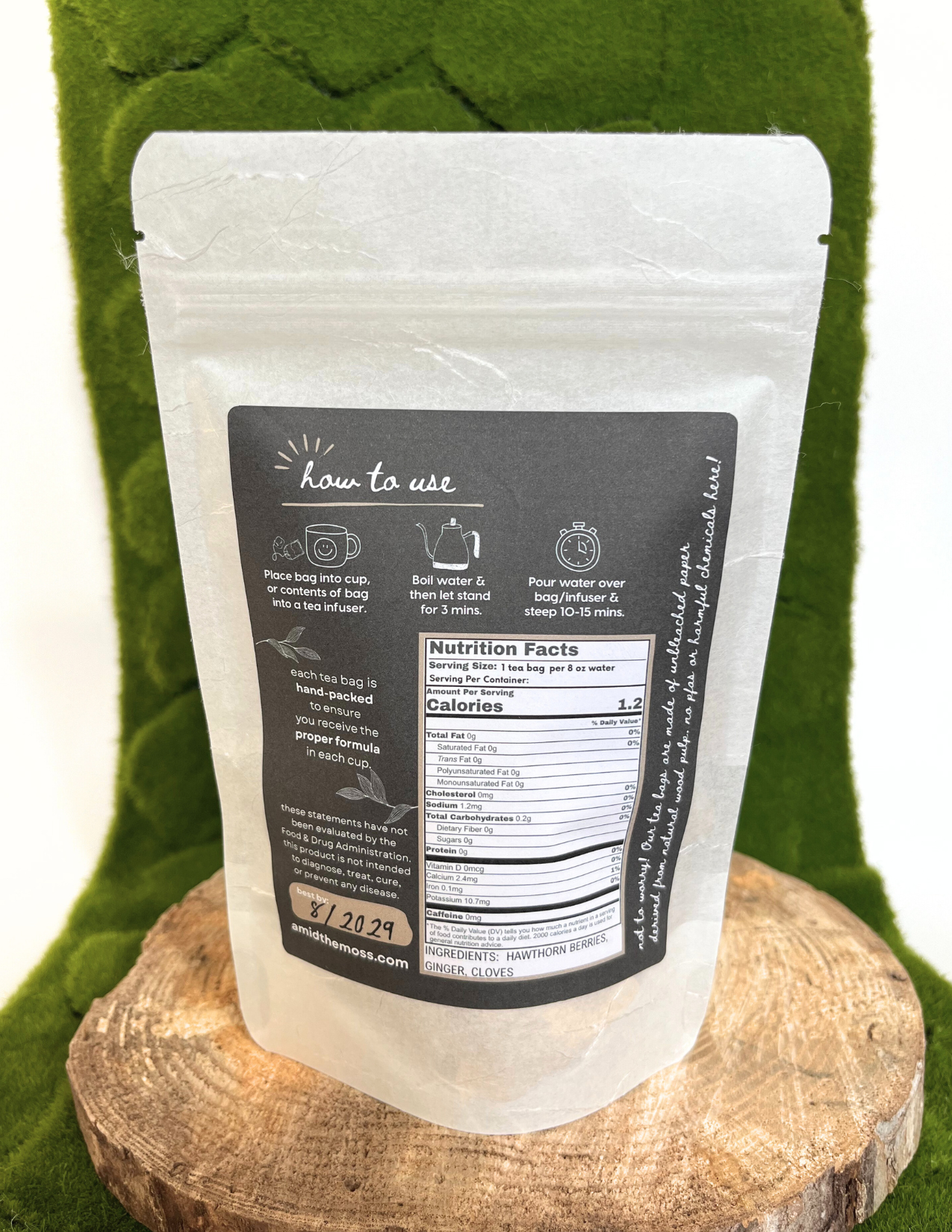 White snack package with black label on a green fabric background